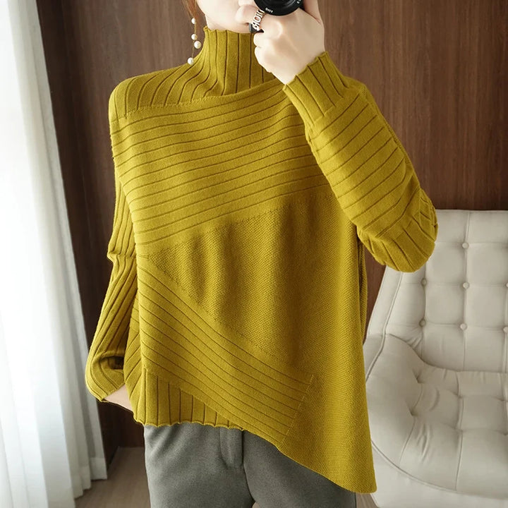 Gemütlicher pullover mit hohem kragen und asymmetrischem saum